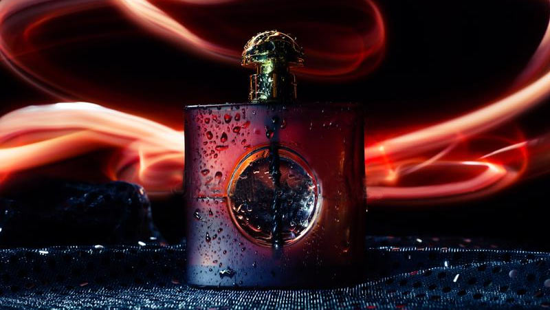 Image of Opium Perfume Bottle On Fire